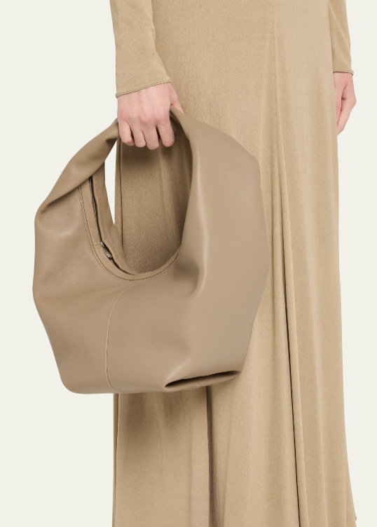 Beige übergroße lässige Hobo‑Schultertasche aus weichem Leder mit integriertem gedrehtem Gurt